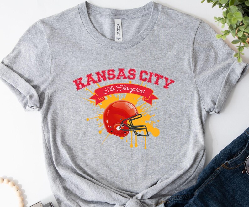 a kansas city football helmet on a gray shirt