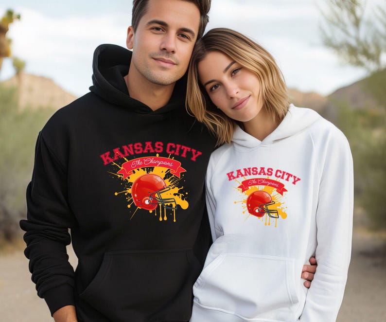 a man and a woman wearing kansas city hoodies