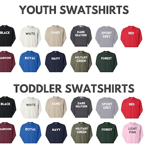 a collection of youth sweatshirts in various colors and styles, including black, white, sand, dark grey, sport grey, red, maroon, royal, navy, forest green, and light pink.