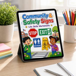 May include: A digital tablet displaying a Community & Safety Signs Life Skills Worksheets cover. The graphic features a red stop sign, green exit sign, blue restroom sign, and yellow wet floor sign, with two children pointing at the illustrations.