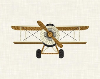 May include: An embroidered biplane design featuring two stacked wings, a central propeller, and two landing wheels. The aircraft is rendered in shades of brown, cream, and black thread, showcasing detailed stitching patterns on the wings and fuselage.