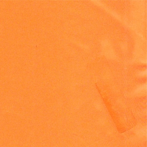 May include: A solid, vibrant orange fabric with a smooth, uniform texture. The material displays subtle folds and light variations across the surface, creating a soft, matte appearance. The color is consistent throughout the entire visible area.