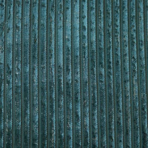May include: A deep teal fabric featuring a vertical ribbed texture. The material displays a consistent pattern of raised, parallel lines that create a dimensional surface with a slight sheen, highlighting the dark blue-green color throughout.
