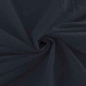 May include: A solid dark charcoal gray fabric featuring a smooth, matte texture. The material is gathered in the center, creating deep, flowing folds and soft shadows that radiate outward across the surface, highlighting the consistent dark tone.
