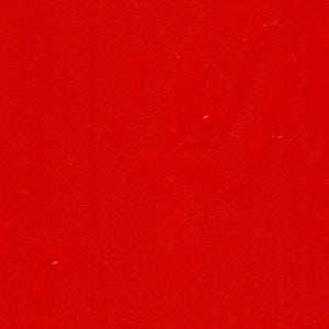 May include: A solid, vibrant red surface with a smooth, uniform texture. The color is a deep, saturated primary red that covers the entire frame evenly, displaying a consistent tone throughout without any patterns, gradients, or additional elements.