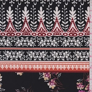 May include: A fabric featuring a black background with a repeating horizontal pattern of white leaf-like shapes, red geometric triangles, and white floral bands. Below these borders, the fabric displays a scattered floral print with pink and yellow flowers.