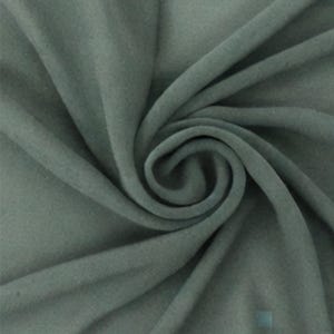 May include: A solid sage green fabric with a soft, matte texture. The material is draped in a central spiral pattern, creating deep, flowing folds and shadows that highlight the consistent color and smooth, uniform surface of the textile.