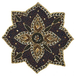 May include: A star-shaped decorative patch featuring a dark navy blue fabric base with a dense, intricate pattern of gold and silver metallic embroidery, small gold sequins, and dark thread accents arranged in a symmetrical floral motif.