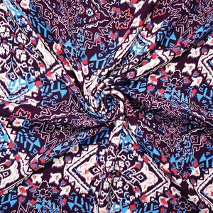 May include: A fabric featuring a dark purple base with a repeating geometric pattern in white, bright blue, and coral red. The design consists of intricate symmetrical shapes and lines that create a dense, interconnected visual texture across the surface.