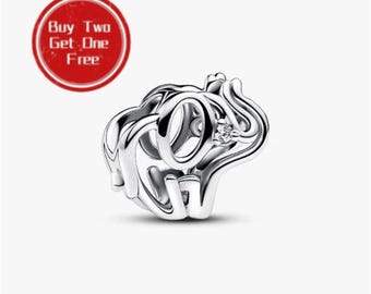May include: A silver-toned metal charm bead shaped like an elephant with an openwork design and a small clear stone set near the eye. A red circular badge in the upper left corner displays the white text Buy Two Get One Free.
