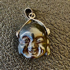 Black laughing Buddha Pendant on silver bezel.