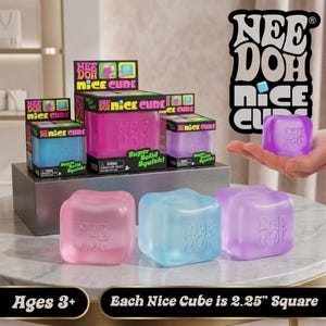 May include: Nee Doh Nice Cube sensory toys in pink, blue, and purple. The cubes are translucent, squishy, and feature the Nee Doh logo embossed on the side. Packaging boxes are displayed behind the cubes, and text states each cube is 2.25 inches square.