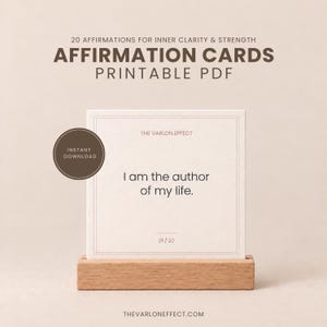 May include: A square affirmation card in a wooden stand featuring the text 'I am the author of my life.' The card includes the header '20 AFFIRMATIONS FOR INNER CLARITY & STRENGTH', 'AFFIRMATION CARDS PRINTABLE PDF', 'THE VARLON EFFECT', and '01/20'.