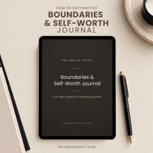 May include: A digital tablet displaying the title Boundaries & Self-Worth Journal, A 30-day practice in choosing yourself, and The Varlon Effect. The screen is dark with white text. A black pen with gold accents rests beside the tablet.