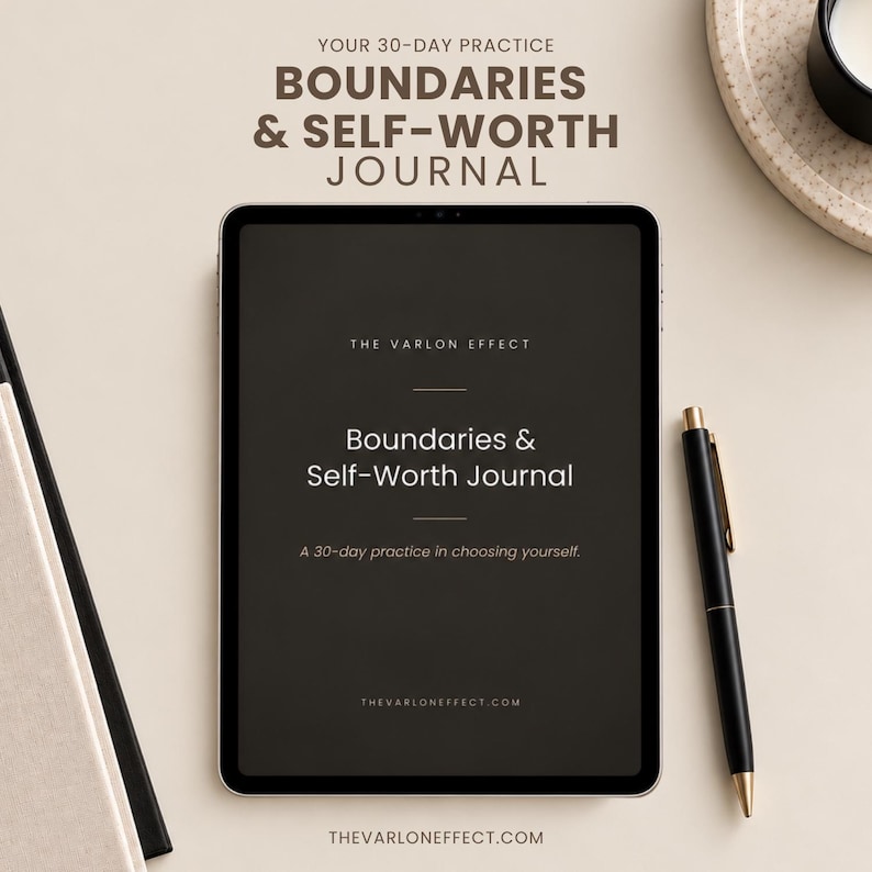 May include: A digital tablet displaying the title Boundaries & Self-Worth Journal, A 30-day practice in choosing yourself, and The Varlon Effect. The screen is dark with white text. A black pen with gold accents rests beside the tablet.