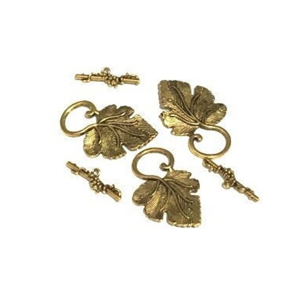 Toggle Clasps, 3 finished toggle clasps, grape leaf size about 37x20mm, bar size about 22x2mm. Antique gold, silver and copper toggle clasps