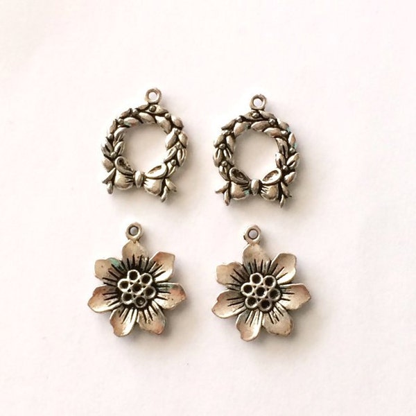 4 metal Charm beads antique silver look. Assorted Beads 2 flowers and 2 wreath Antique Silver tone.  jewelry finding and supplies.