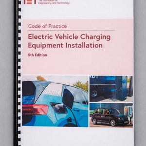May include: A spiral-bound manual titled Code of Practice Electric Vehicle Charging Equipment Installation 5th Edition by The Institution of Engineering and Technology. The cover features a blue car charging and two smaller images of charging stations.