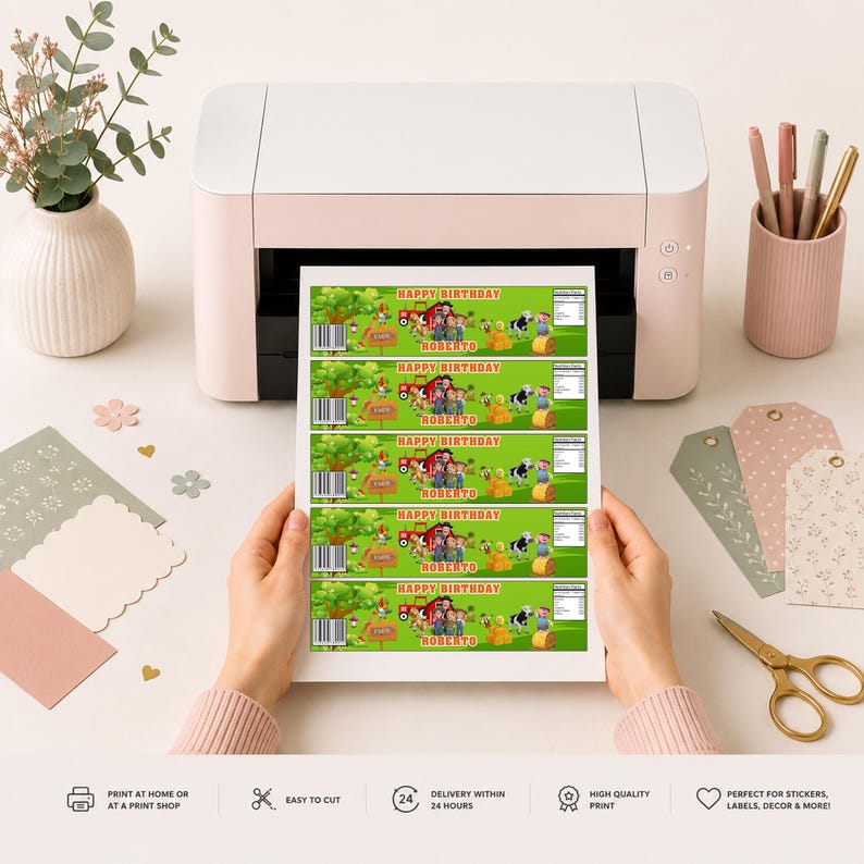 May include: A white printer outputting a sheet of five identical rectangular labels featuring a green farm scene with a red tractor, a cow, hay bales, and the text Happy Birthday Roberto. The labels include a barcode and nutrition facts.
