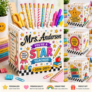 May include: A white square desk organizer with a building block top edge, featuring colorful graphics of stars, apples, and pencils. The text reads Mrs. Anderson, You're a Star Teacher, Best Teacher Ever, and 2026-2027. It holds pencils, scissors, and a wooden ruler.
