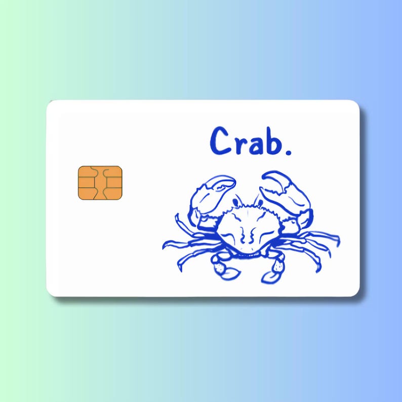 Może przedstawiać: Biała prostokątna karta z niebieskim rysunkiem kraba i napisem Crab. wykonanym niebieską czcionką. Karta posiada złoty metalowy chip po lewej stronie, typowy dla standardowej karty płatniczej lub karty identyfikacyjnej.