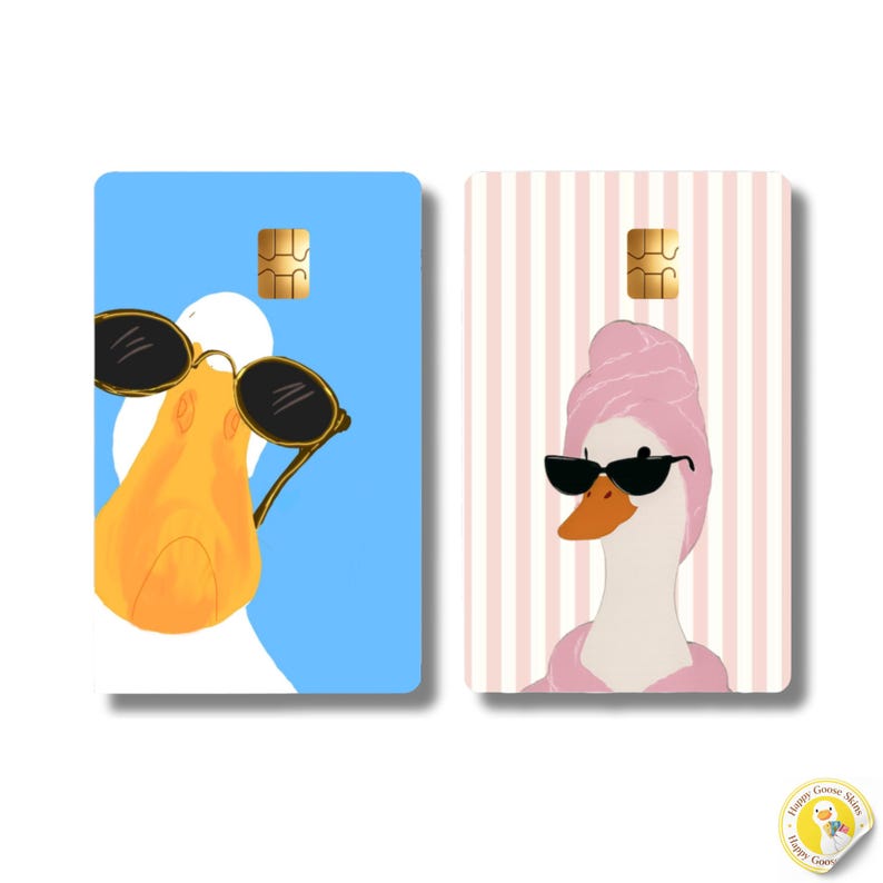 May include: Two rectangular credit card skins featuring cartoon geese. The left skin has a blue background with a goose wearing black sunglasses. The right skin has a pink and white striped background with a goose wearing a pink towel and sunglasses.