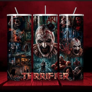 May include: A cylindrical tumbler with a straw featuring a collage of horror-themed imagery, including a central clown face, dark scenes, and the red text "TERRIFIER" printed along the bottom edge. The design uses a dark color palette with red accents.
