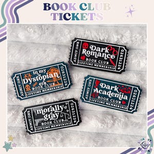 May include: Four rectangular ticket-shaped pins featuring the text "ADMIT ONE" and "LIFETIME MEMBERSHIP". The designs include "Dark Romance" with a skull, "Dystopian era" with a mushroom cloud, "Dark Academia" with a rose, and "morally gray" with a scale.