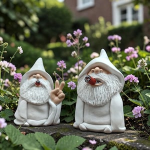 May include: Two white wizard figurines with long beards and pointed hats. The smaller figurine on the left makes a peace sign with one hand and holds a small dark object in its mouth. The larger figurine on the right holds a red cigar in its mouth.