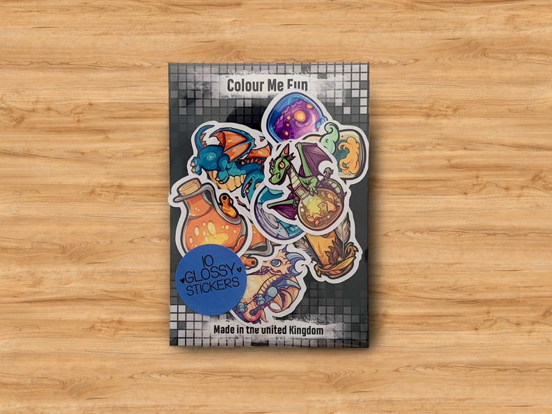 May include: A set of 10 glossy stickers featuring colorful illustrations of dragons, potions, and other fantasy elements. The stickers are packaged on a card with the text "Colour Me Fun" and "10 Glossy Stickers".