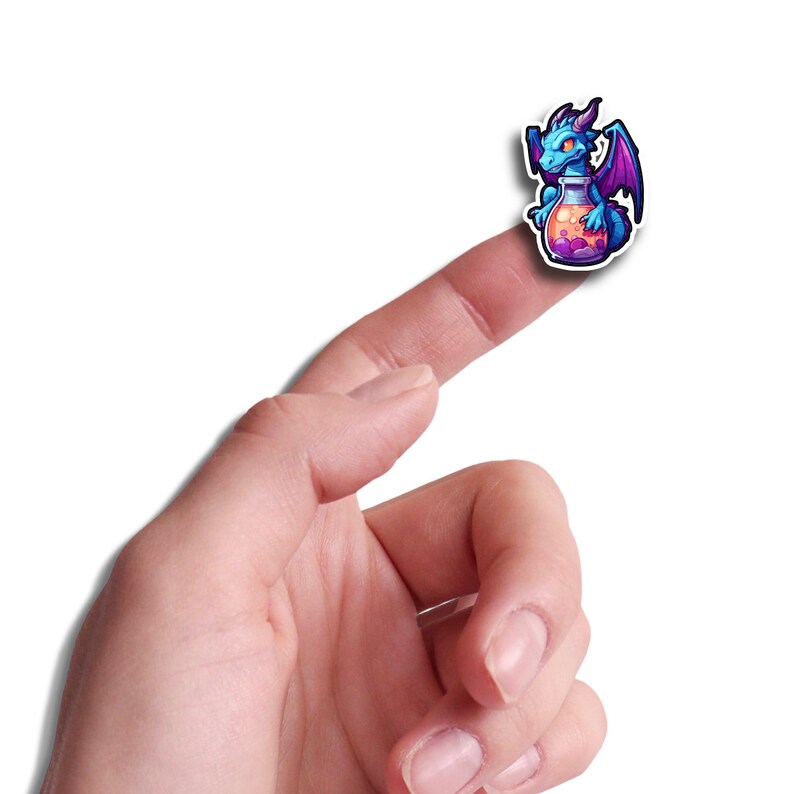May include: A blue and purple dragon sticker holding a potion bottle. The sticker is on a finger.