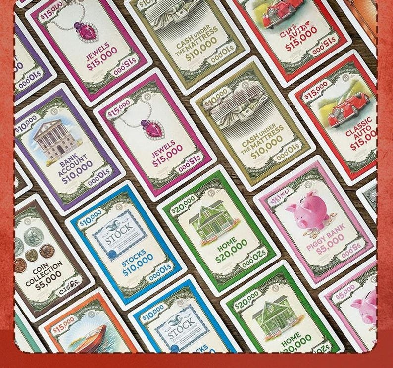 May include: A collection of rectangular game cards featuring illustrations of assets like jewels, cash, cars, houses, and piggy banks. Each card displays a specific dollar value, such as $5,000, $10,000, $15,000, or $20,000, along with text labels like Stocks, Bank Account, and Home.