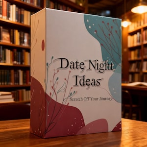 May include: A rectangular box with a white background featuring abstract teal and maroon organic shapes, thin branch illustrations, and the text Date Night Ideas Scratch Off Your Journey printed in a dark, stylized serif font on the front.