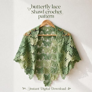 May include: A sage green crochet shawl featuring a repeating butterfly lace pattern, displayed on a wooden hanger. The text above reads butterfly lace Shawl crochet pattern, and the text below reads Instant Digital Download.