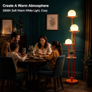 May include: A tall orange floor lamp featuring three vertical poles of varying heights, each topped with a spherical white glass globe light. The lamp includes a circular base and a small integrated shelf for plants, emitting a soft warm glow.