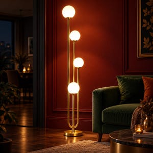 May include: A tall floor lamp featuring a slender gold-toned metal frame with four vertical stems of varying heights. Each stem is topped with a spherical white glass globe light, creating a tiered arrangement that emits a warm, soft glow.