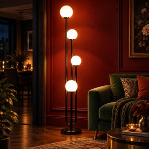 May include: A tall floor lamp featuring a slender black metal frame with four vertical poles of varying heights. Each pole is topped with a spherical white glass globe light, creating a tiered arrangement of illuminated orbs in a vertical line.
