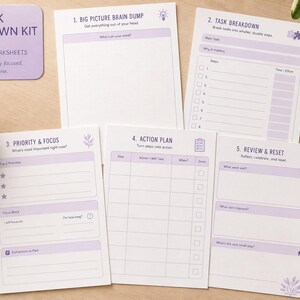 May include: A task breakdown kit featuring five printable worksheets with light purple accents. The sheets include sections titled Big Picture Brain Dump, Task Breakdown, Priority & Focus, Action Plan, and Review & Reset, with various prompts and checkboxes for organisation.