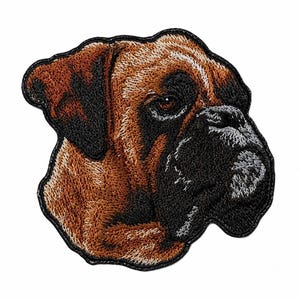 May include: An embroidered patch featuring the head of a Boxer dog. The design showcases the dog's characteristic tan and brown fur with a prominent black muzzle and dark ears. The embroidery uses detailed stitching to define the facial features.