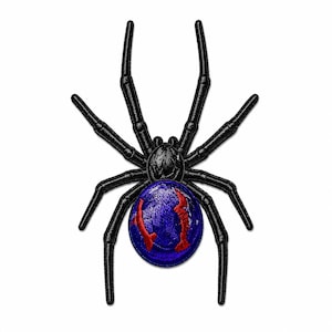 May include: An embroidered patch in the shape of a spider with eight black legs and a central body section. The spider features a round, vibrant blue abdomen decorated with two distinct, curved red markings that resemble stylized fangs or claws.