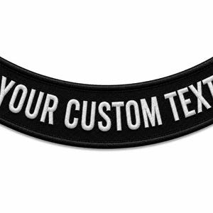 May include: A curved, black embroidered patch featuring the white text YOUR CUSTOM TEXT in a bold, sans-serif font. The patch has a thick black border and a textured fabric finish, designed to be attached to garments or accessories as a custom label.