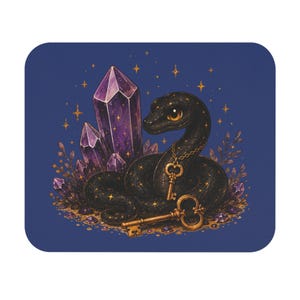 May include: A rectangular mouse mat featuring a black snake with gold star patterns, coiled around purple crystal clusters. The snake wears a gold chain with a key pendant, and a second gold key lies on the ground amidst small purple crystals.