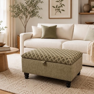 May include: A square storage ottoman featuring a textured olive green base and a removable lid with a repeating diamond pattern in shades of green and beige. The ottoman is supported by four short, dark brown, rounded wooden feet.