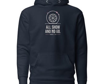 May include: A navy blue hooded sweatshirt featuring a white graphic of a car wheel above the text "ALL SHOW AND NO GO." and "TORQUE & TIN" printed in a distressed font. The hoodie includes a front kangaroo pocket and long sleeves.
