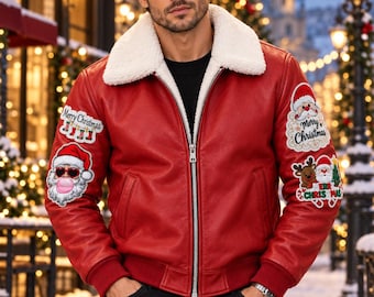 May include: A red leather bomber jacket with a white faux-shearling collar and silver zipper. The sleeves feature embroidered patches including Santa Claus, reindeer, and the text Merry Christmas. The jacket has ribbed cuffs and a hem.