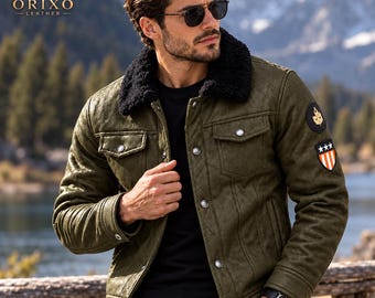 May include: An olive green jacket with a black faux fur collar, featuring silver-toned buttons, two chest pockets, and two patches on the left sleeve. One patch is circular with a leaf icon, and the other is a shield shape with stars and stripes.