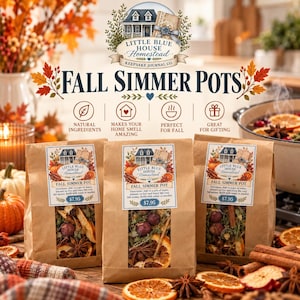 May include: Three brown paper bags labeled Little Blue House Homestead Fall Simmer Pots, each containing dried orange slices, star anise, and berries. The labels feature a house illustration and instructions for use, with a price of $7.95 printed on each.