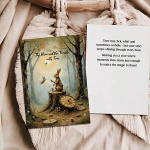 May include: A whimsical book cover titled "The Hare and the Trouble with Time" featuring a rabbit in a waistcoat, a clock, and a bird. A white card with text is next to the book. The scene is set in a forest.
