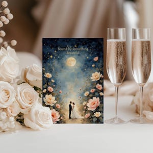 May include: A wedding-themed card with the text "Bound by Something Beautiful" features a couple standing under a full moon, surrounded by flowers. Two champagne flutes with bubbly liquid are on the right, and a bouquet of white roses is on the left.