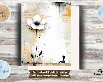 May include: A set of 6 note cards measuring 4.25 inches by 5.5 inches with 6 white envelopes. The card features a white anemone flower, a silhouette of a person sitting, abstract paint splatters in black and yellow, and the text Anemone.